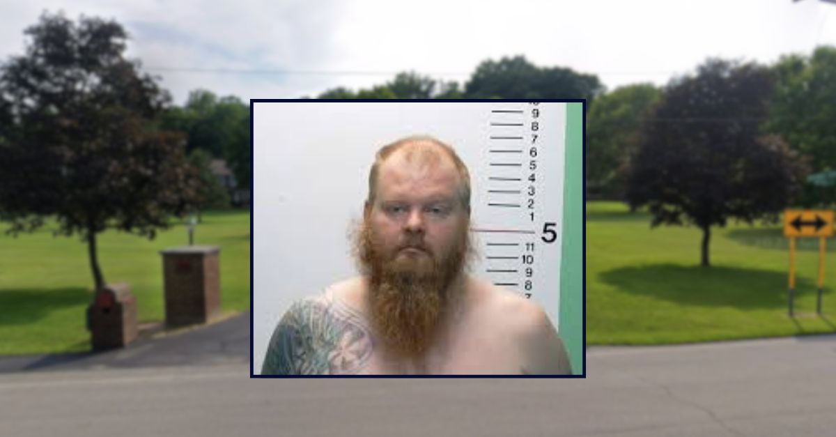 Phillip Lovely appears in booking photo inset against an image of a road in Ohio.